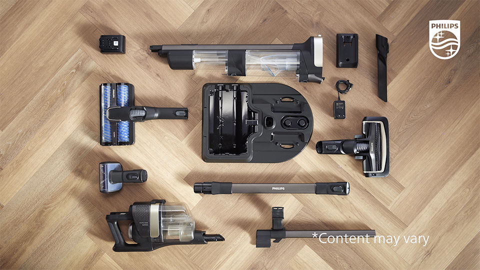 Odkurzacz Philips AquaTrio rozłożony na poszczeg&oacute;lne części i elementy.