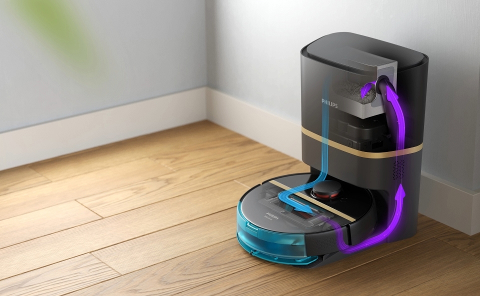 Robot sprzątający na stacji ładowania, automatycznie opr&oacute;żniający się.